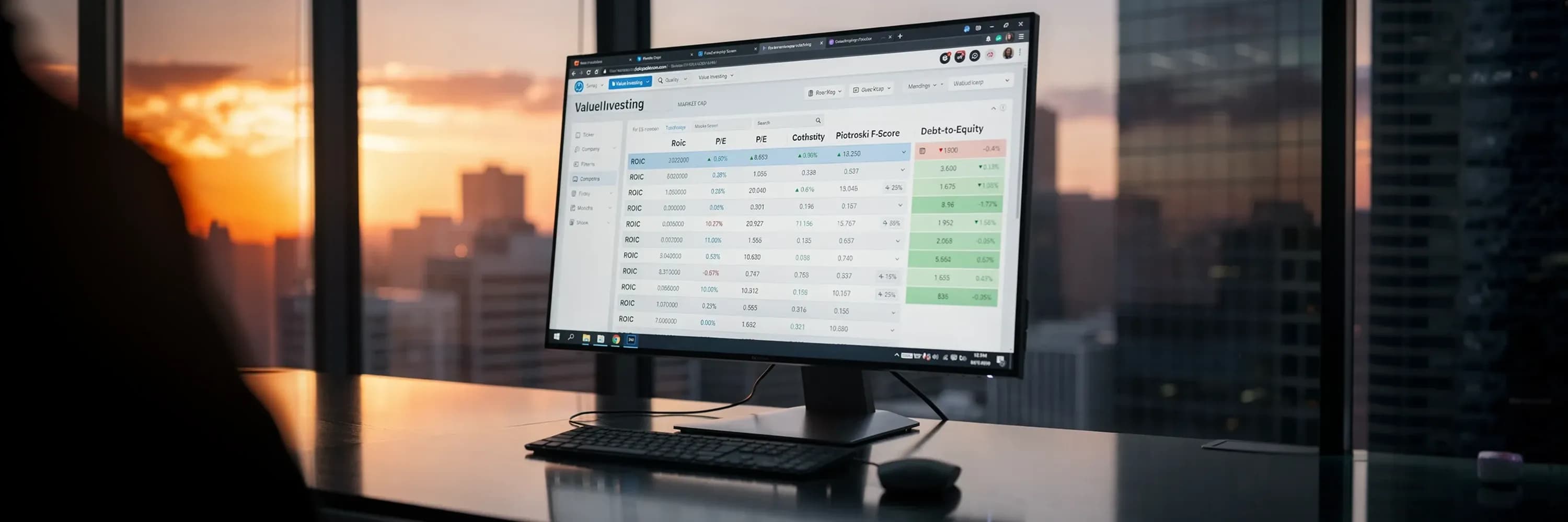 Computer monitor displaying stock market analysis dashboard with value investing metrics and financial ratios in modern office at sunset